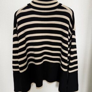 Toteme Black and Cream Striped Turtleneck Sweater